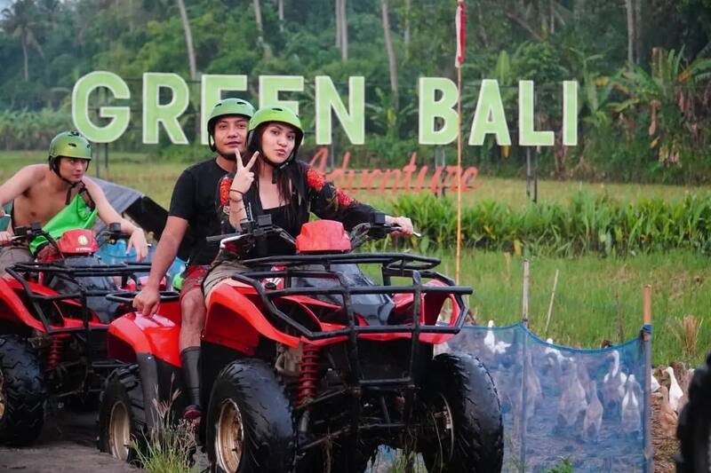 Couple Riding Red Atv Helmets Green Bali Adventure Sign