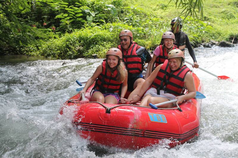 Group Of People Enjoying White Water Rafting Adventure