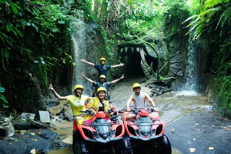 Group Of People Riding Atv Touring Jungle Cave Waterfalls