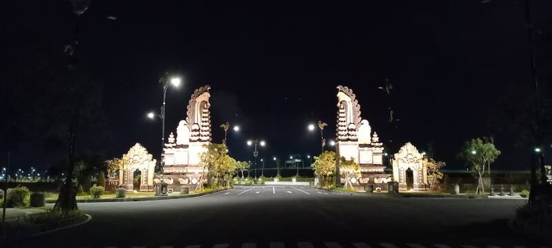 Illuminated Traditional Gate Archway Night Empty Road Trees