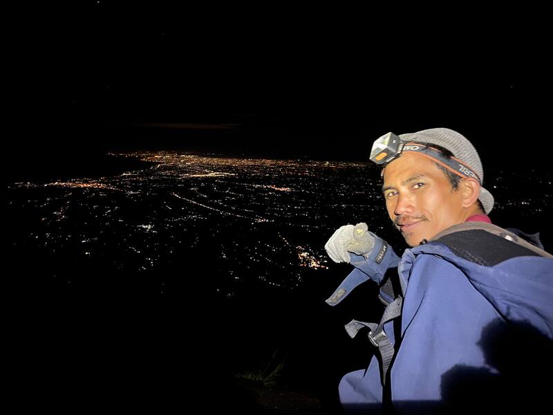 Man Hiker Wearing Headlamp Night Cityscape View Winter Clothing