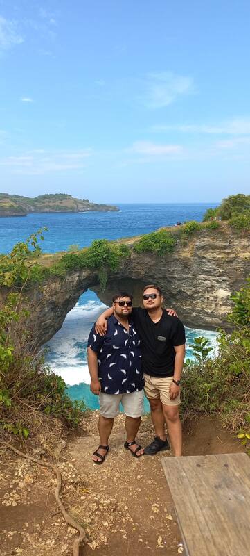 Two Men Posing Ocean Cliff Natural Rock Arch Formation