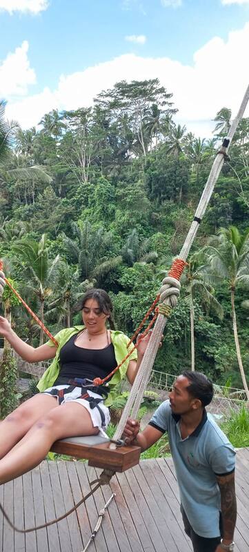 Woman On Wooden Swing Tropical Forest Mountain Man Assisting